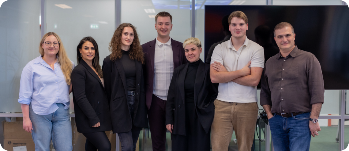 full-team-of-warehouse-employees-standing-in-wareh-2024-10-22-02-32-42-utc