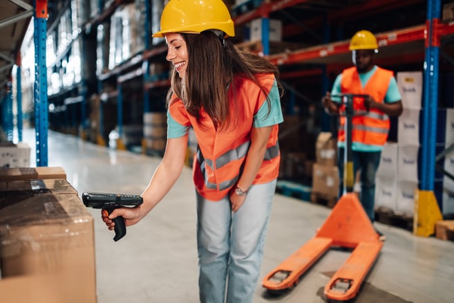 warehouse-worker-scanning-packages-with-barcode-sc-2025-03-30-21-53-51-utc